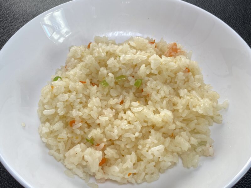 Close-up of cooked shrimp pilaf with vegetables visible